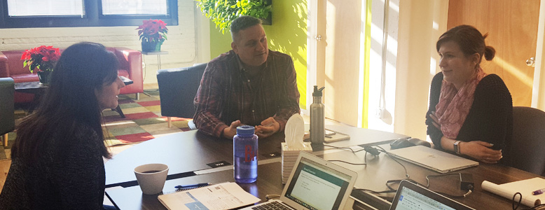 Mightybytes CEO Tim Frick discusses a project with clients