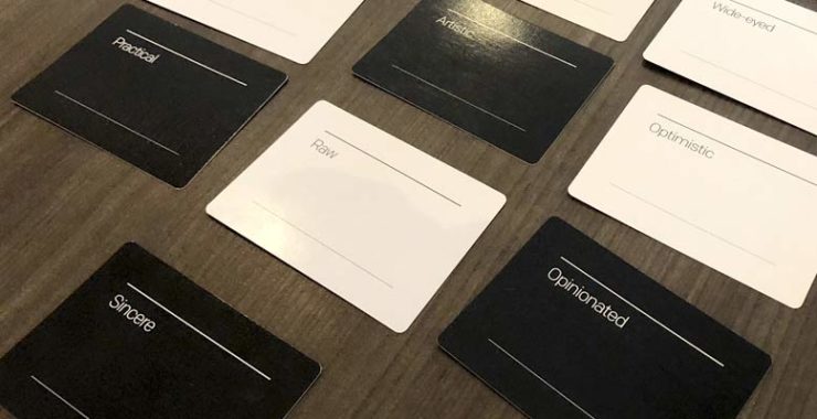 image of brand deck cards on a table used to define brand value terms in a content strategy.